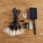Solar string light set with solar panel, remote control, and lights on a wooden surface