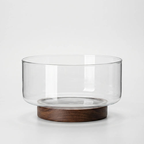 Clear Glass Serving Bowl with Walnut Wood Stand in a nice white studio. 