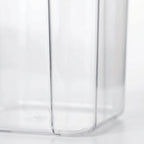Clear Stackable Food Container detail on the side of it in a white studio. 
