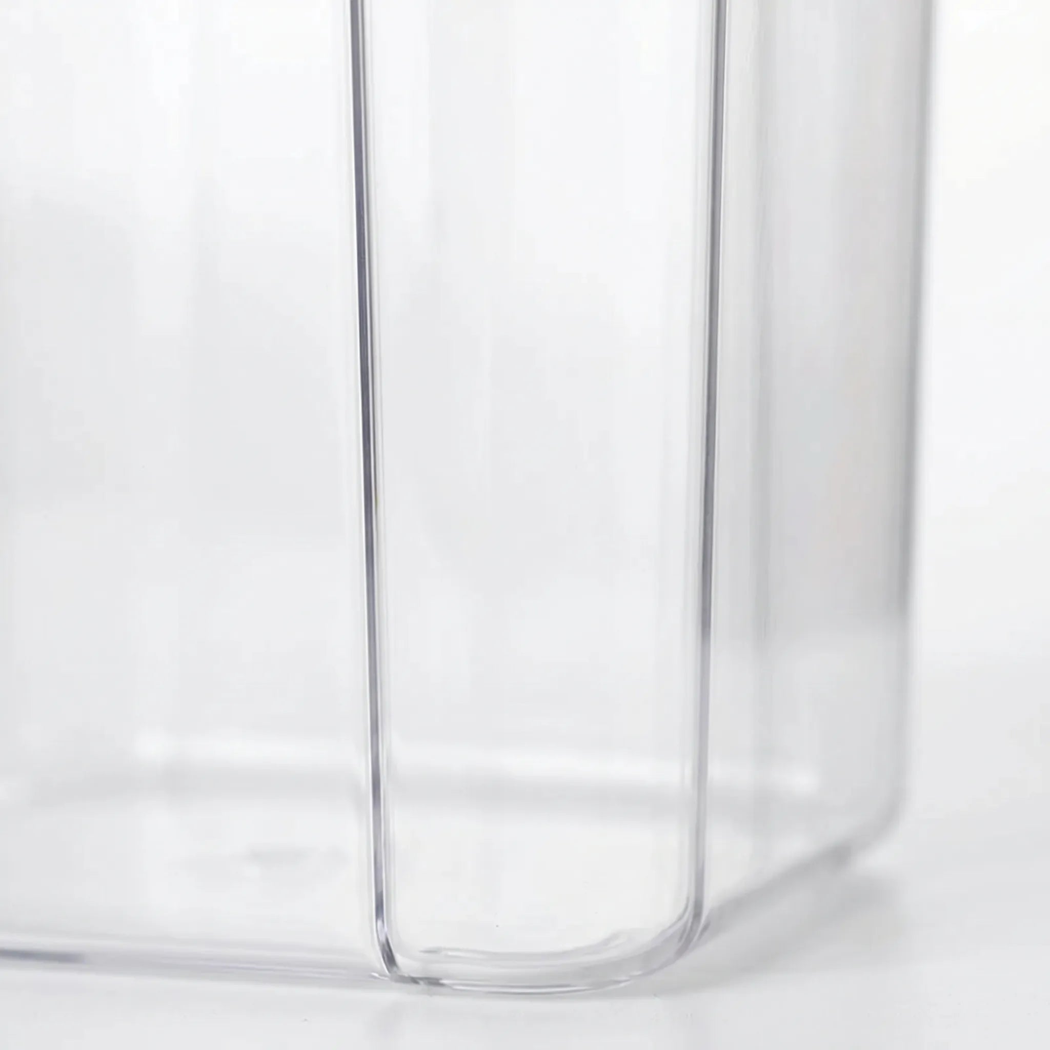 Clear Stackable Food Container detail on the side of it in a white studio. 