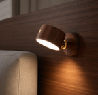 Wooden wall sconce on a wooden wall with a blurred background