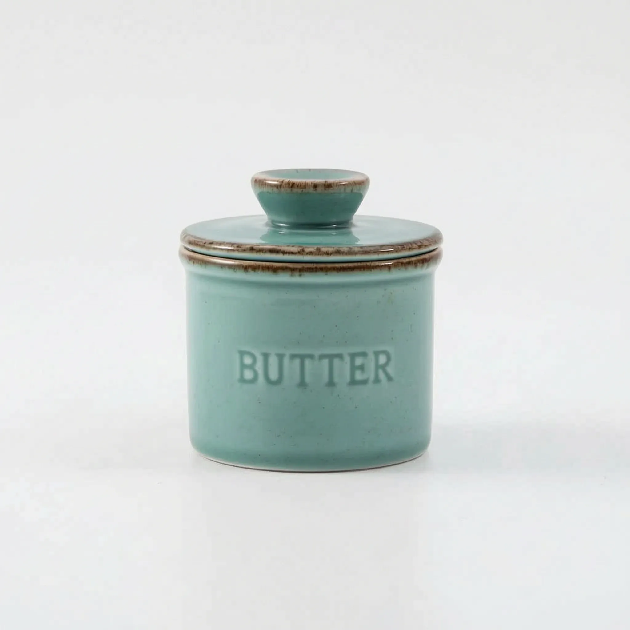  French Butter Crock – Speckled Stoneware Keeper in a turqoise in a white studio. 