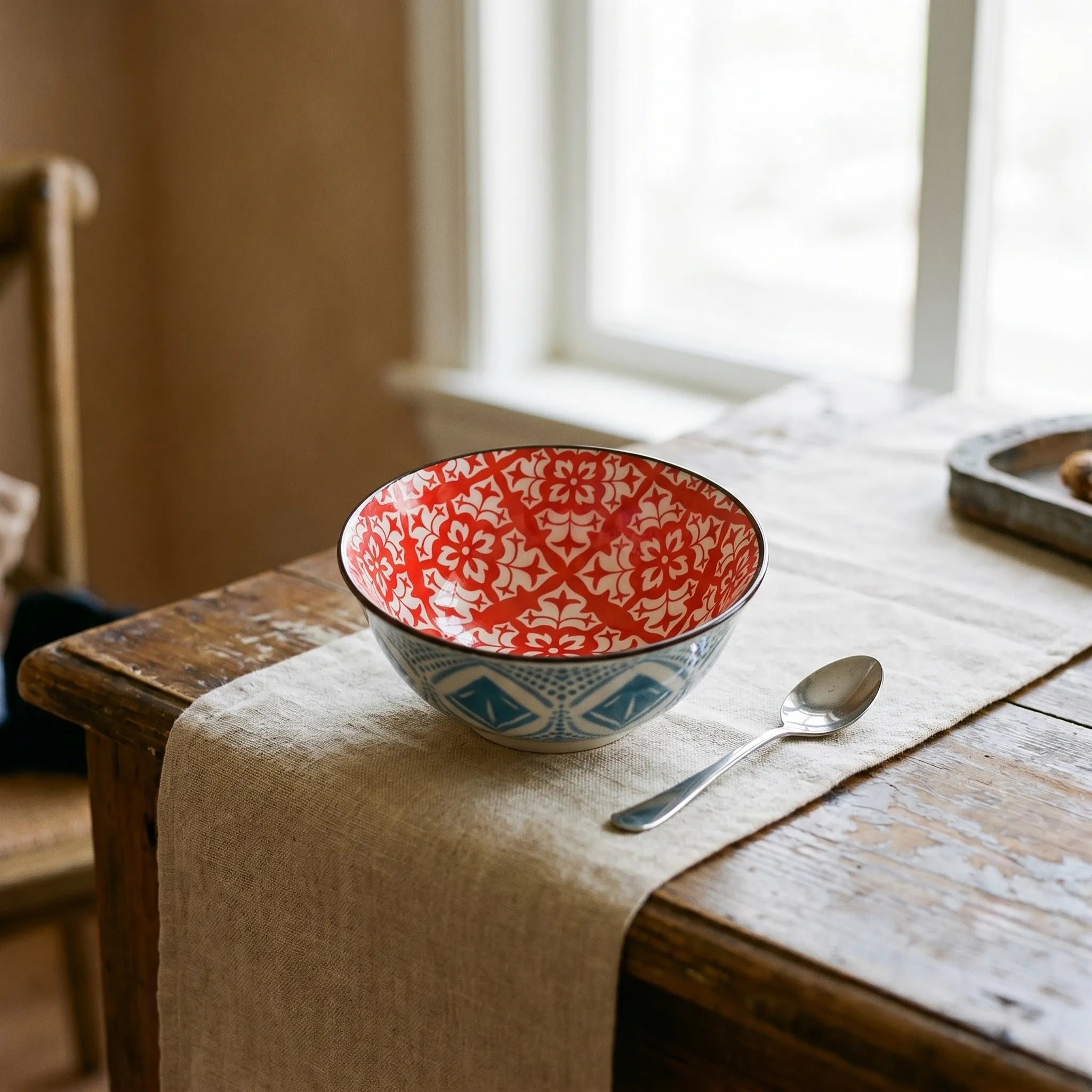 Patterned Ceramic Bowl Set in a red pattern on the inside and blue pattern on the outside. 