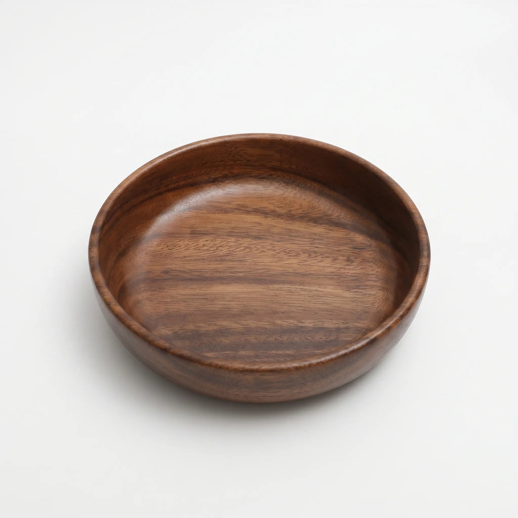 Solid Wood Serving Bowl – Natural Walnut in a nice white studio. 