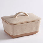Speckled Stoneware Butter Dish – Cream with Lid in a nice white studio,