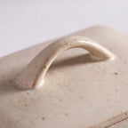 Speckled Stoneware Butter Dish – Cream with Lid closeup in a studio. 