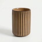 Cylindrical ceramic vase with striped pattern on a white background
