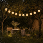 Outdoor setting with string lights, table, and chairs in a garden.