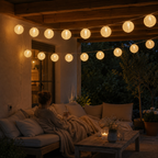 Woman sitting on a couch under string lights in a cozy outdoor setting