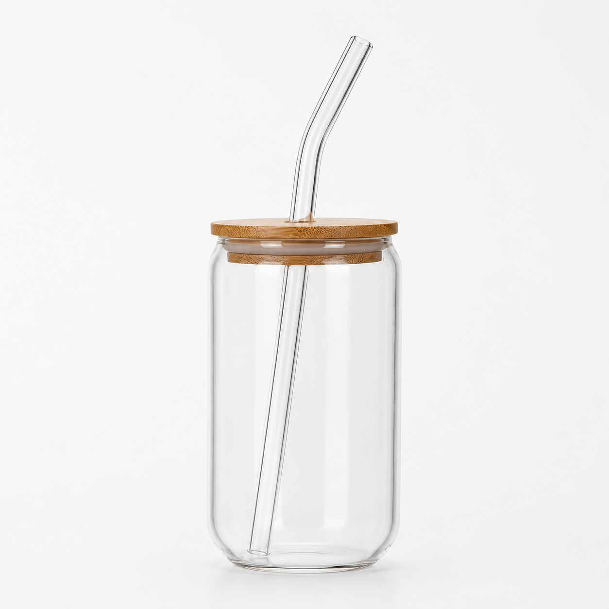 Clear glass tumbler with a wooden lid and glass straw on a white background