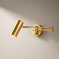 Gold wall-mounted lamp on a beige background