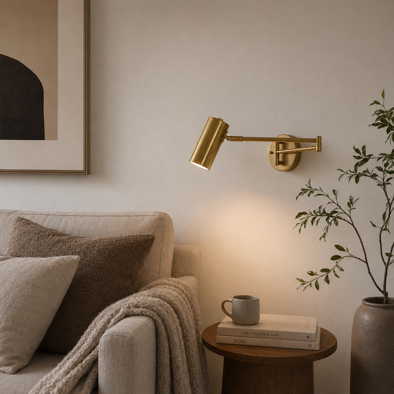 Living room with a gold wall lamp, beige sofa, and wooden side table.