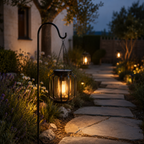 Garden pathway with solar lanterns illuminating a stone path at night.