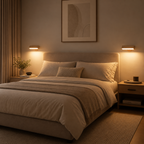 Cozy bedroom with a bed, nightstands, and wall art in warm lighting.