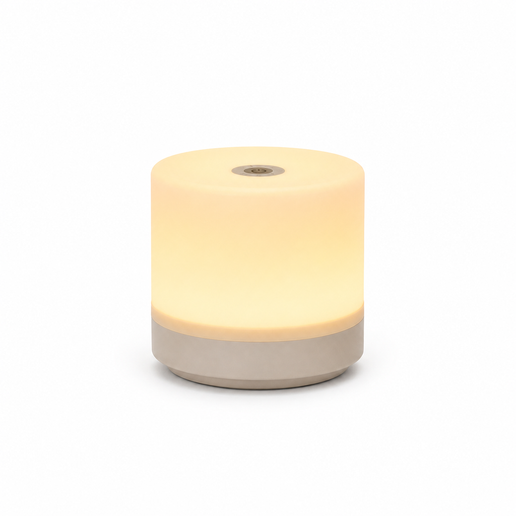 Round night light with a beige base and yellowish-white glow on a white background