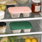 Refrigerator shelves with food containers and jars