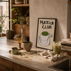 Kitchen counter with matcha preparation items and a 'Matcha Club' sign.
