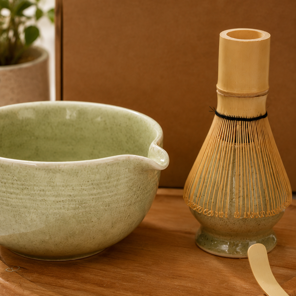 Ceramic bowl and whisk on a wooden surface with a blurred background