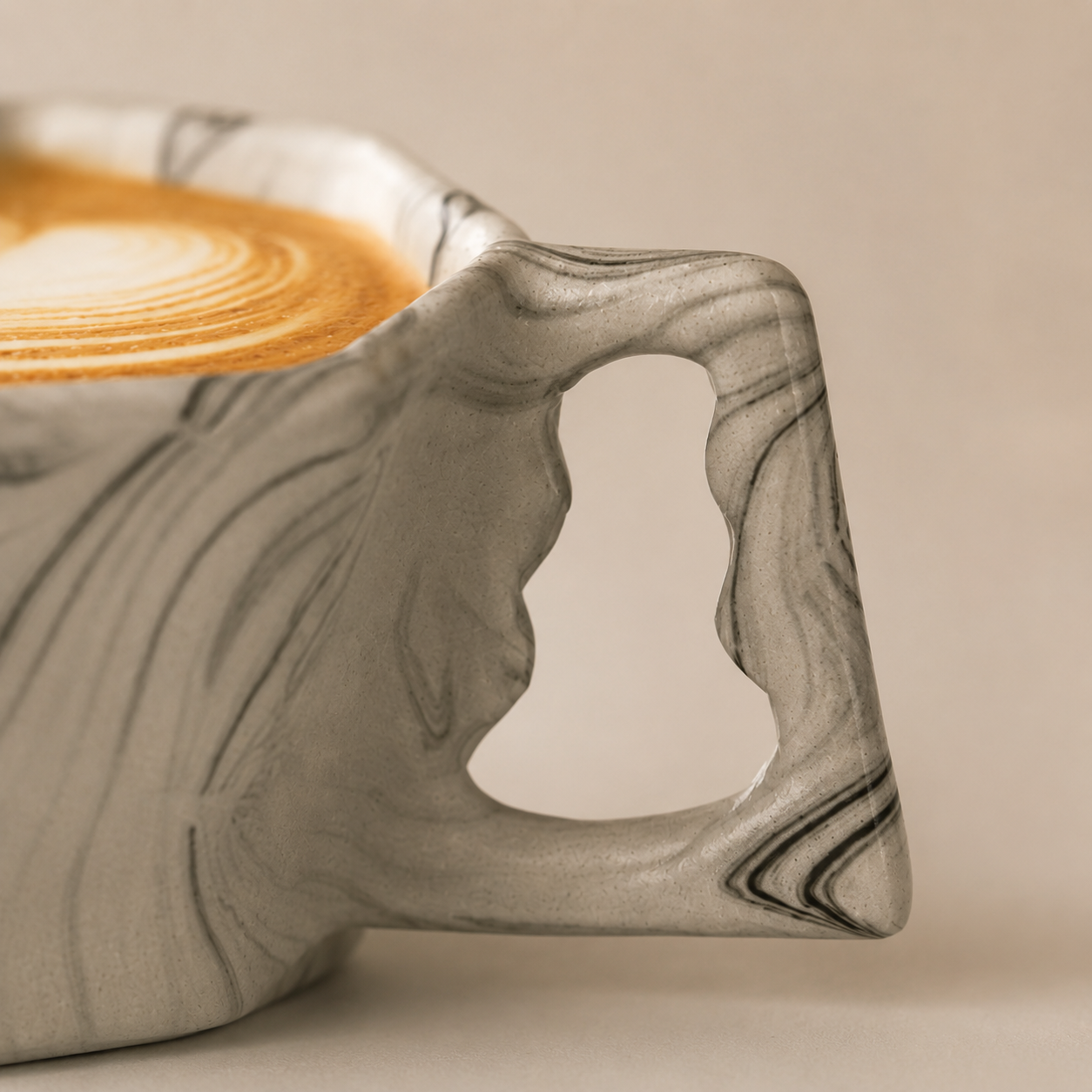 Close-up detail of the unique handle on an octagonal ceramic mug