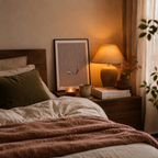 Cozy bedroom with bed, nightstand, lamp, and decor items.