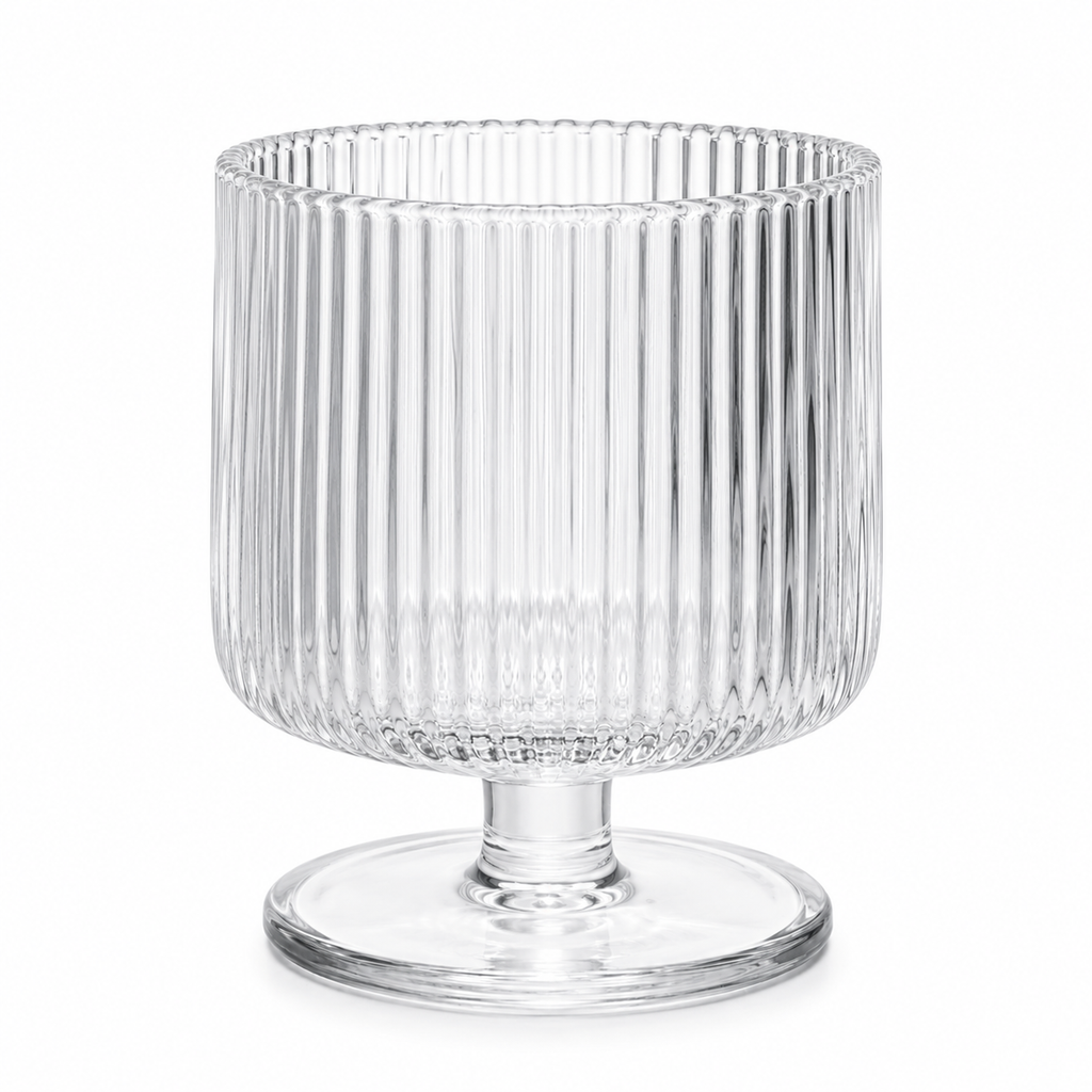 Clear glass vase with ribbed design on a white background