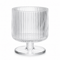 Clear glass vase with ribbed design on a white background