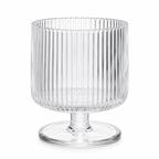 Clear glass vase with ribbed design on a white background
