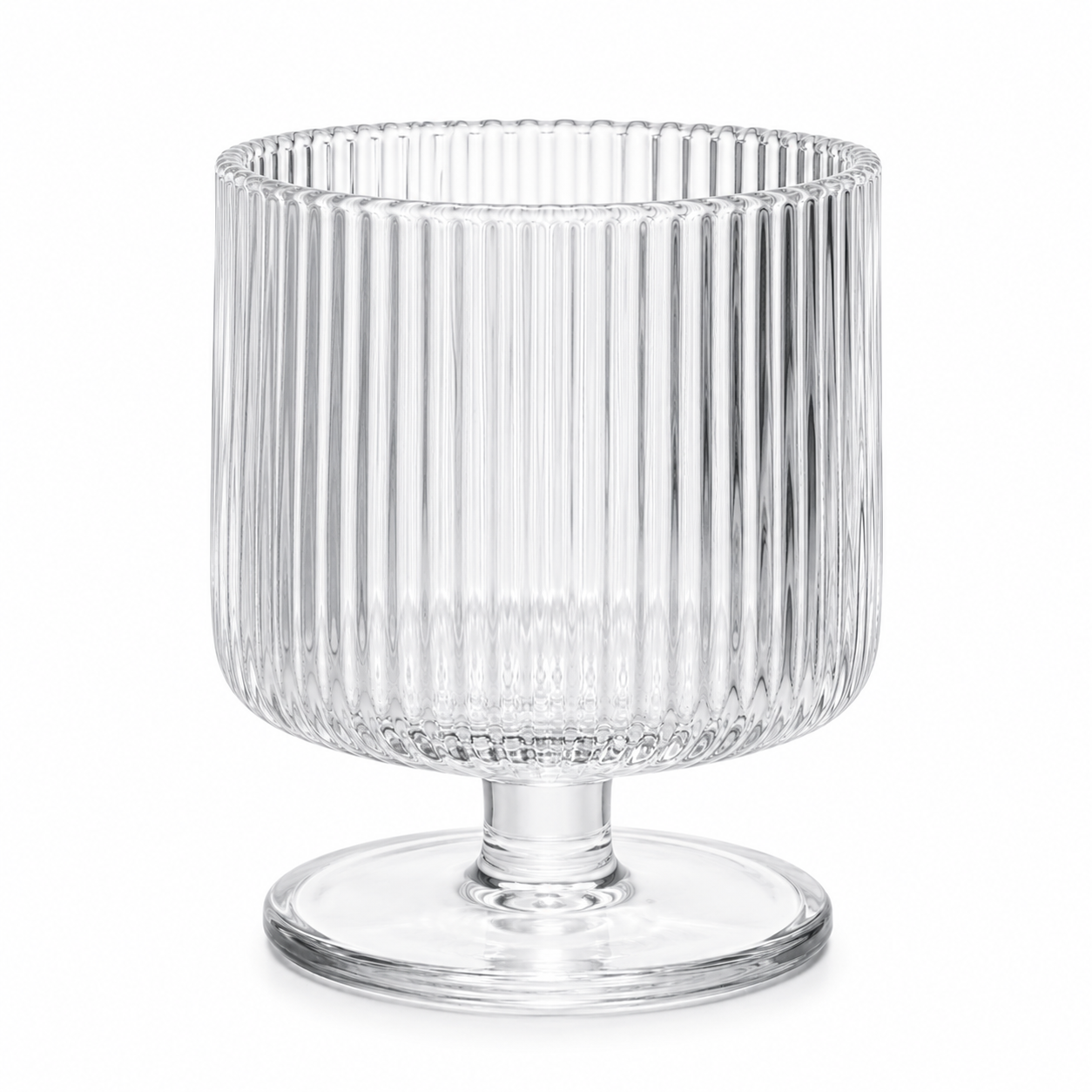 Clear glass vase with ribbed design on a white background