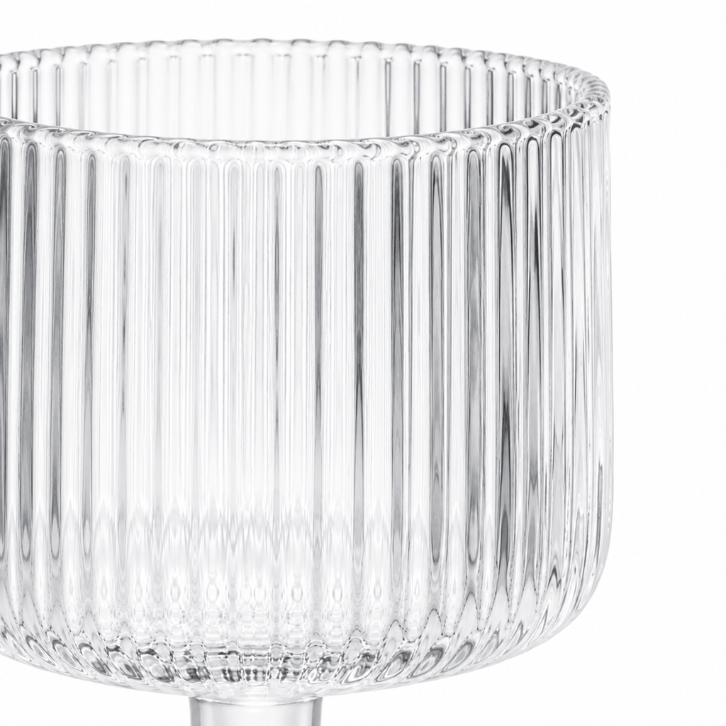 Clear glass vase with ribbed design on a white background
