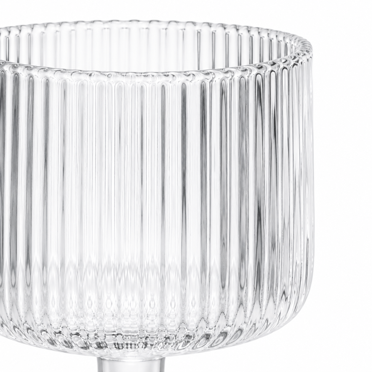 Clear glass vase with ribbed design on a white background