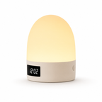 Round night light with digital clock display on a white background