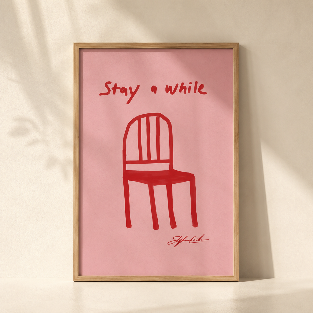 Red Chair Stay A While – Art Print Unframed Foryuni in a modern studio with lightning. 