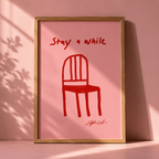 Red Chair Stay A While Print in a freame with a pink background. 