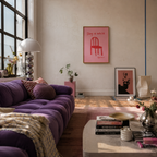 Red Chair Stay A While – Art Print poster in a industrial nice loft room with a cool purple couch. 