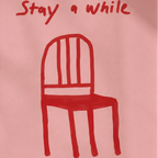 Framed artwork with a red chair illustration and 'Stay a while' text on a pink background