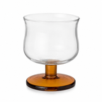 Clear glass candle holder with amber base on a white background